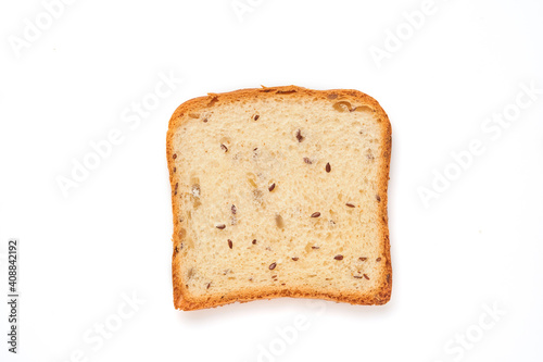 Slices toast bread with pumpkin, poppy, flax, sunflower, sesame and millet seeds isolated on white background for proper nutrition. Top view, flat lay