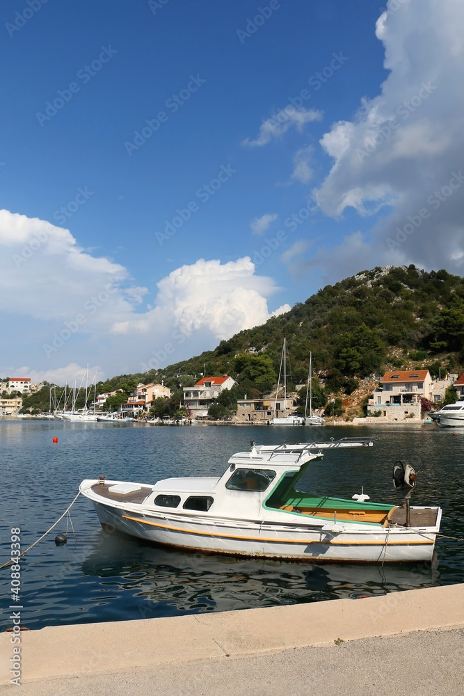 Small fishing boat in the picturesque port on island Lastovo, Croatia.