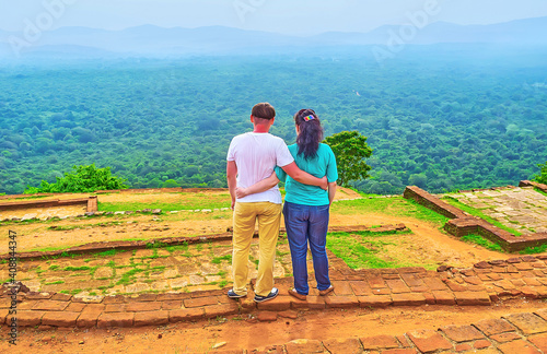 Couple, exploring  Sigiriya Upper Palace, Sri Lanka photo