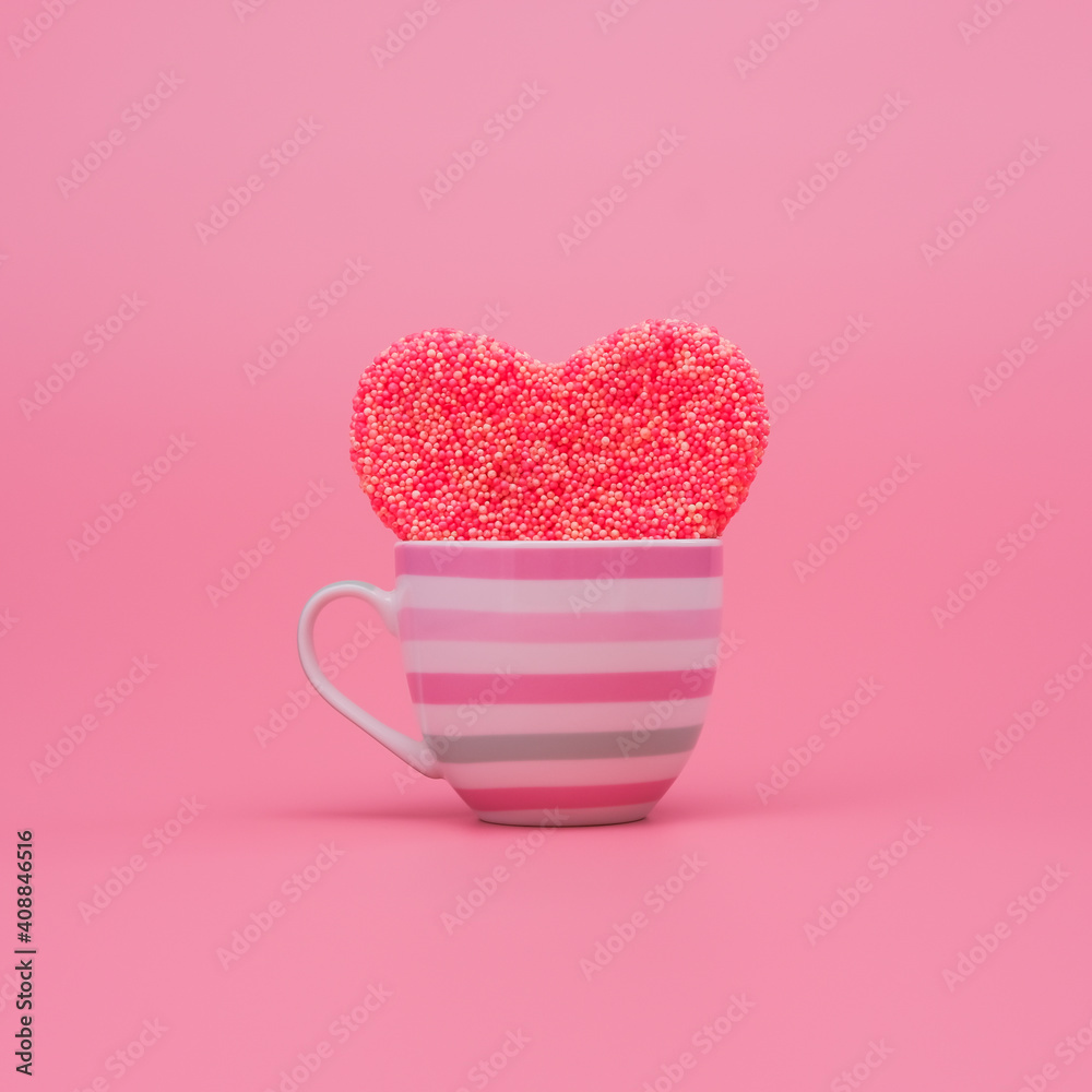 Big heart inside a cup on pink background. Love and passion minimal concept Big heart inside a cup on pink background. Love and passion minimal concept