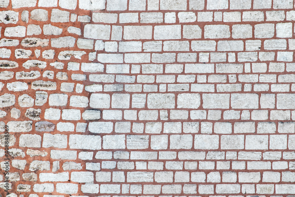 Fototapeta premium Ancient stone wall. Brick wall background close-up.
