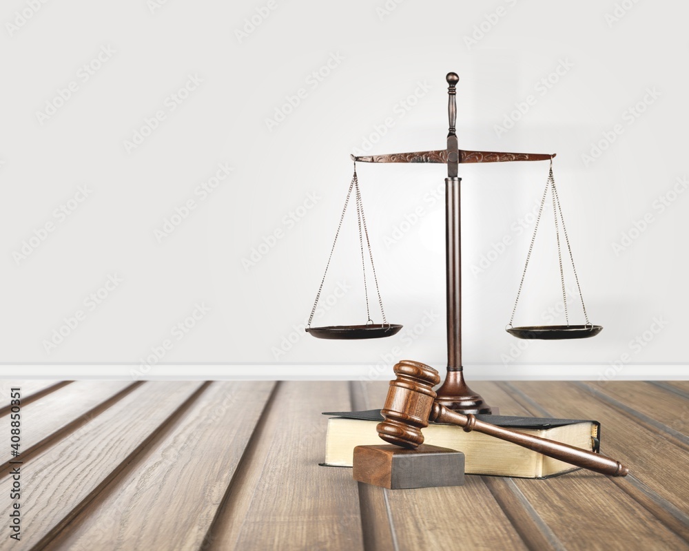 Justice scales and wooden gavel on the table Justice scales and wooden gavel on the table