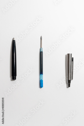 Pen components on a white background.