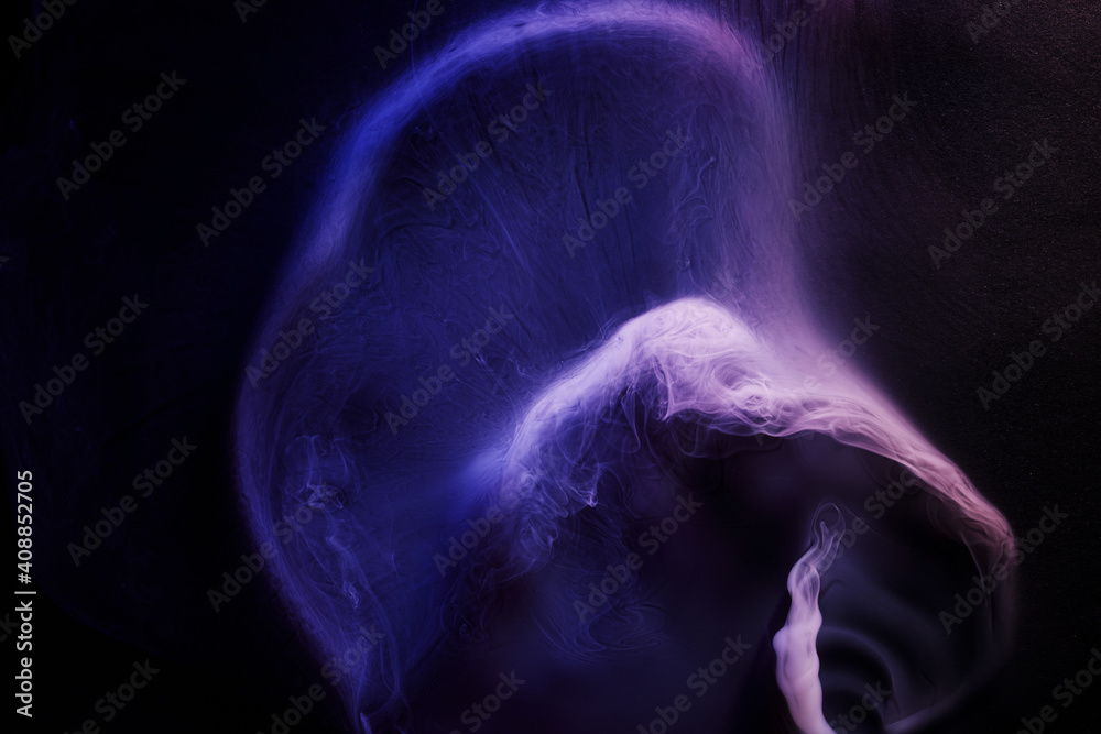 Naklejka premium Abstract purple smoke moves on black background. Beautiful swirling smoke.