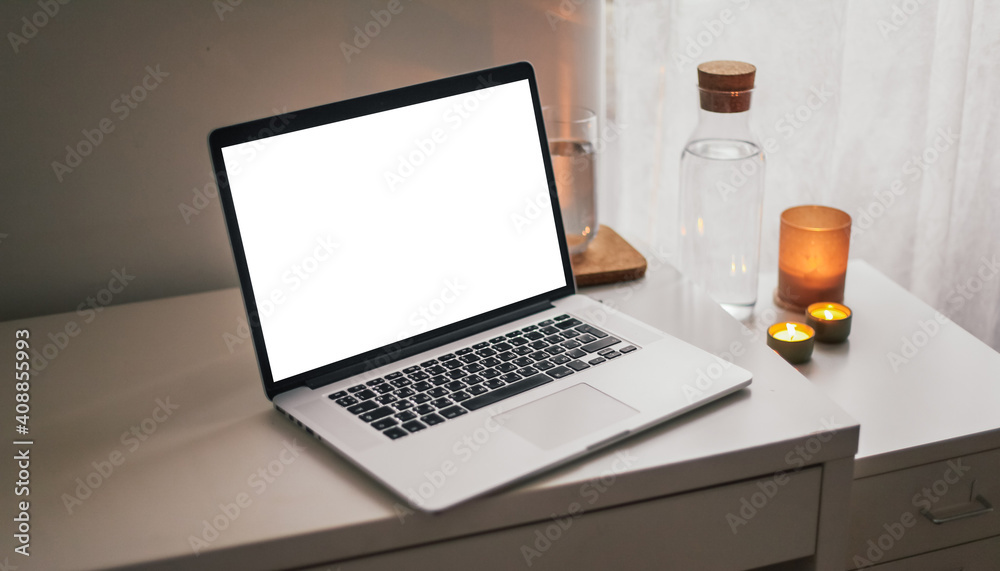 custom made wallpaper toronto digitalA laptop with white screen on a table with a plant, water jar, candles. Cosy atmosphere on a working place 