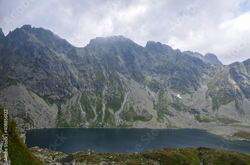 Fototapeta Naklejka Na Ścianę i Meble -  Mountain lake Velke Hincovo pleso under peak Mengusovsky stit in Mengusovska valley in the national park of High Tatras - Slovakia
