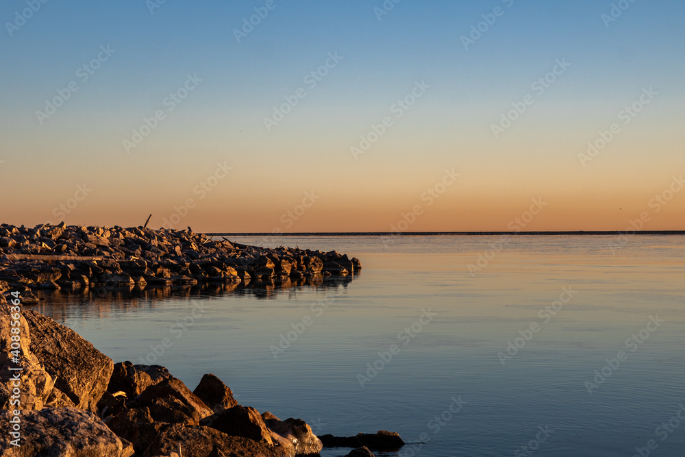 early morning light on rocky shore