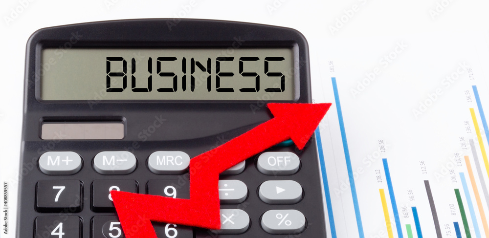 Obraz premium Calculator with red ascending arrow and text Business on the display,concept