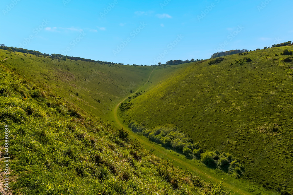 A view across the upper reaches of the longest, widest dry valley on the South Downs near Brighton in springtime