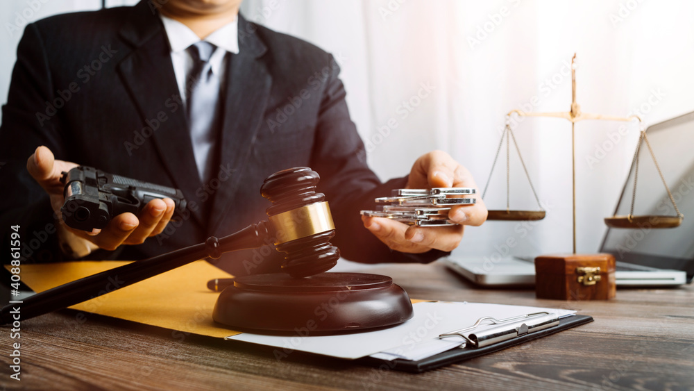 justice and law concept.Male judge in a courtroom on wooden table and Counselor or Male lawyer working in office. Legal law, advice and justice concept. justice and law concept.Male judge in a courtroom on wooden table and Counselor or Male lawyer working in office. Legal law, advice and justice concept.