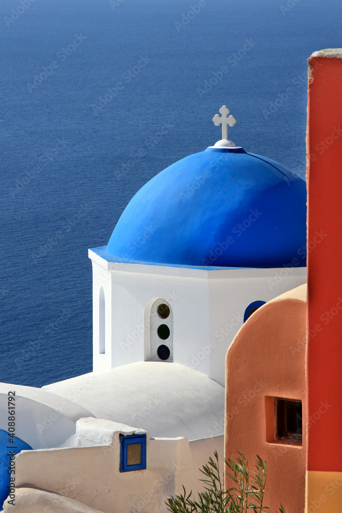 Santorini island, colorful corner at Oia village, full of typical cycladic colors and seaview from the famous caldera of Santorini, in Greece, Europe.