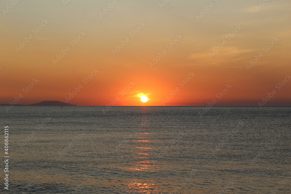 sunset sunrise over the sea and a sunny path on the water