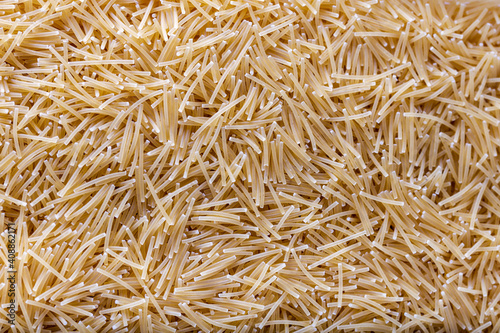 Uncooked vermicelli pasta. Background and texture.