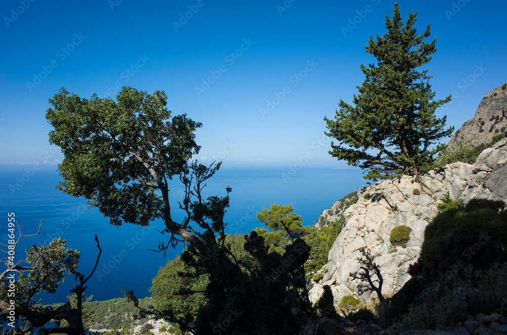 View of Mediterranean sea coast from Lycian way hiking trail high on mountain near Alinca, Nature of Turkey, blue water horizon