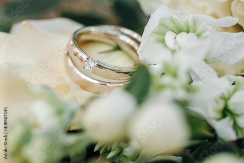 wedding rings with rose flowers, selective focus