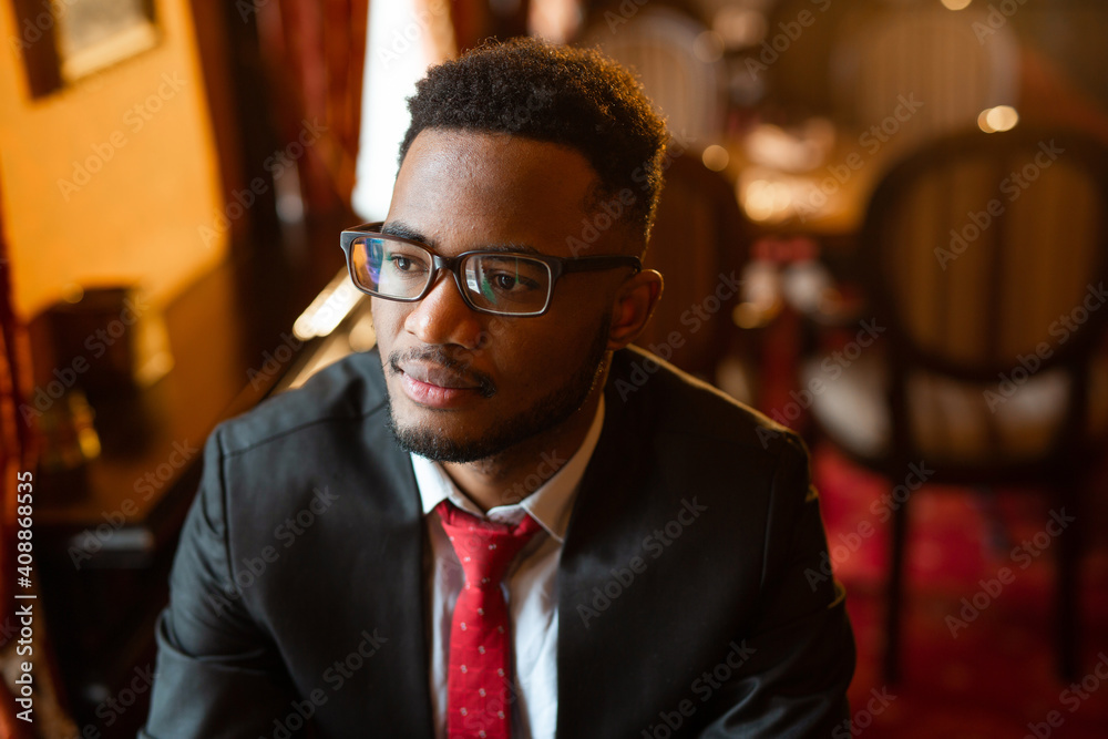 portrait of handsome young african man wearing glasses portrait of handsome young african man wearing glasses