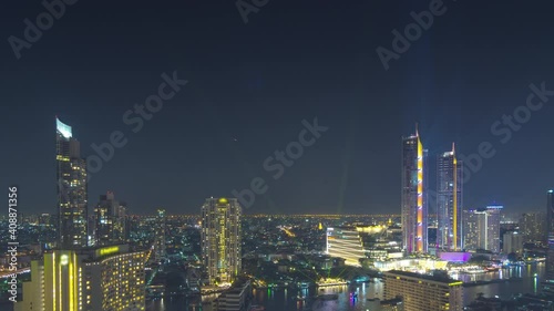 Wallpaper Mural 4k time-lapse video, Chao Phraya River viewpoint, Bangkok, Thailand from a high angle with nighttime water traffic, and New Year's Eve celebrations High-rise buildings adorned with light show. Torontodigital.ca