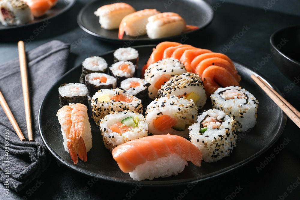 Japanese sushi food. Maki ands rolls with tuna, salmon, shrimp, crab and avocado. Top view of assorted sushi. sushi roll, uramaki, hosomaki and nigiri. Japanese sushi food. Maki ands rolls with tuna, salmon, shrimp, crab and avocado. Top view of assorted sushi. sushi roll, uramaki, hosomaki and nigiri.