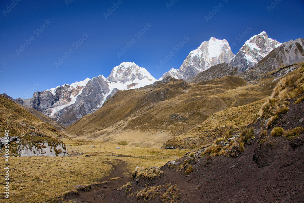 Fototapeta premium Stunning view of views of Yerupajá, Siula Grande, and the high peaks of the Cordillera Huayhuash, Peru