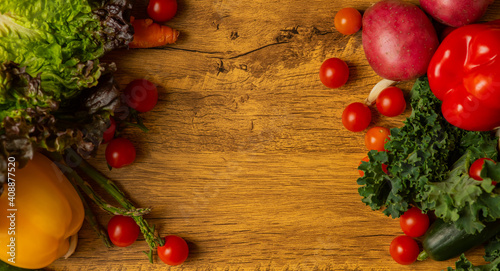 Fresh vegetables on a wooden board background 