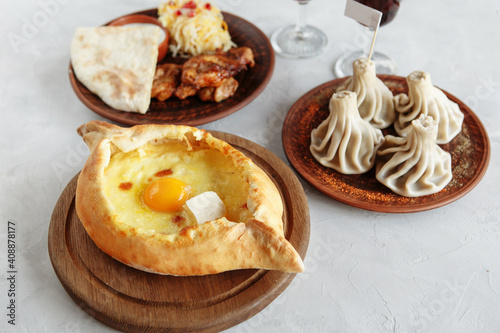 business lunch of khachapuri, khinkali and barbecue with a side dish