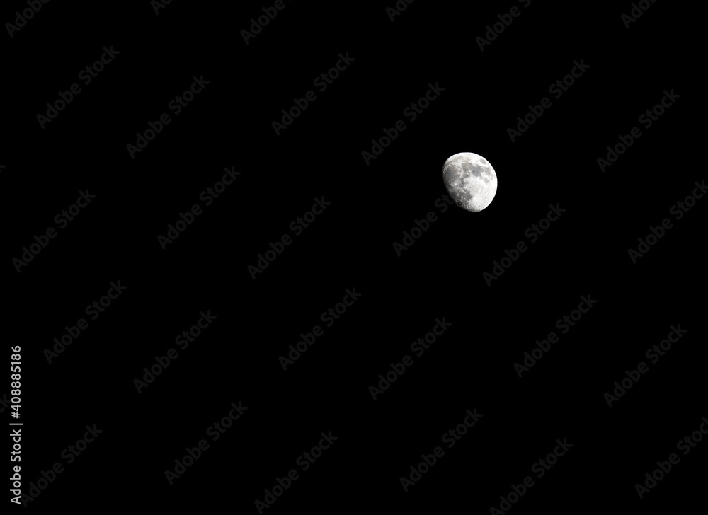 Waxing Gibbous full moon in the night sky Stock Photo Adobe Stock