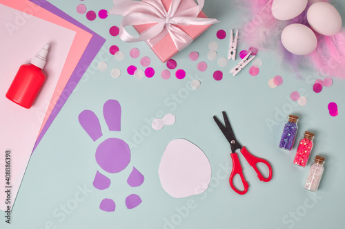 Step-by-step instructions. Easter bunnies. Step 3 Cut out along the contour. DIY. Flat lay. Making an Easter card.