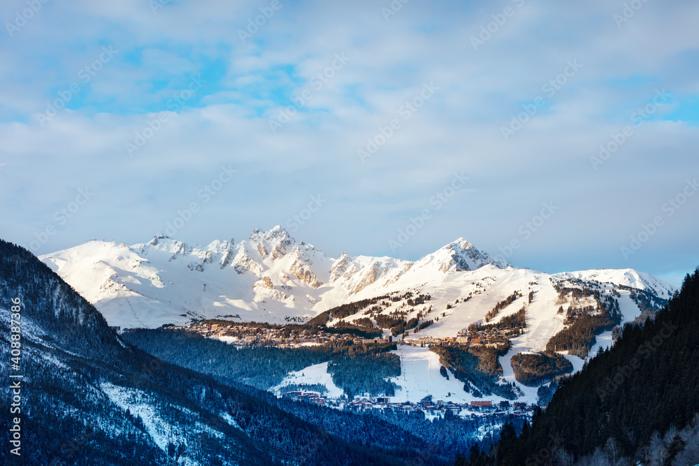 View of Courchevel valley and ski resort with Alps mountain peaks during the sunny day View of Courchevel valley and ski resort with Alps mountain peaks during the sunny day