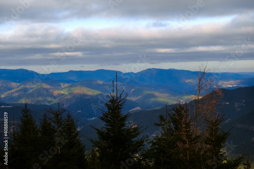 wide view to other mountains and hills with sun