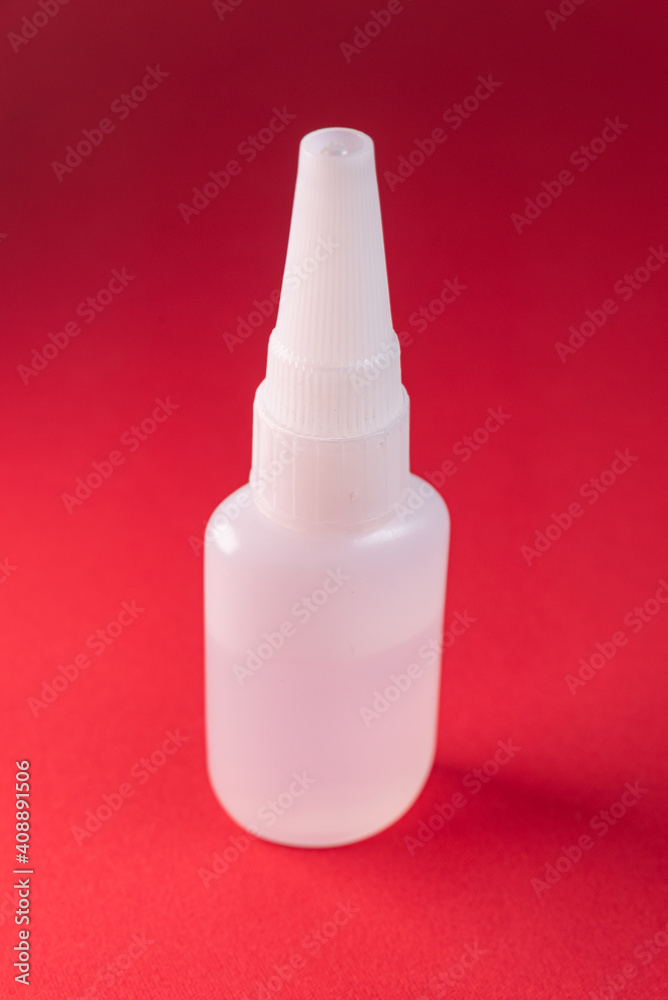 Glue bottle on the colorful background