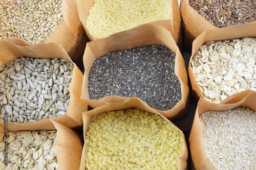 Cereal, grain and seeds in paper bags, healthy whole grains collection