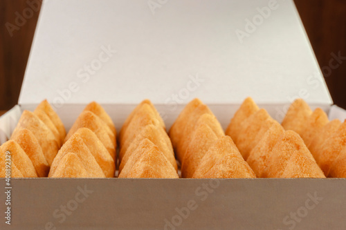 A box of deep fried croquettes for delivery (coxinha de frango) photo