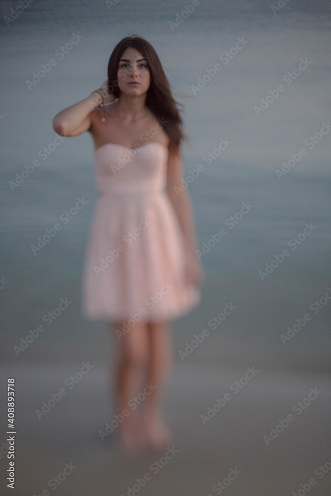 Young slim beautiful woman on sunset beach Young slim beautiful woman on sunset beach