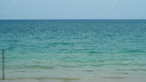 Beautiful colored water of tropical sea change from green to blue shades with distance. Ripply surface seen to horizon. Pure tropical nature at exotic islands of Thailand photo