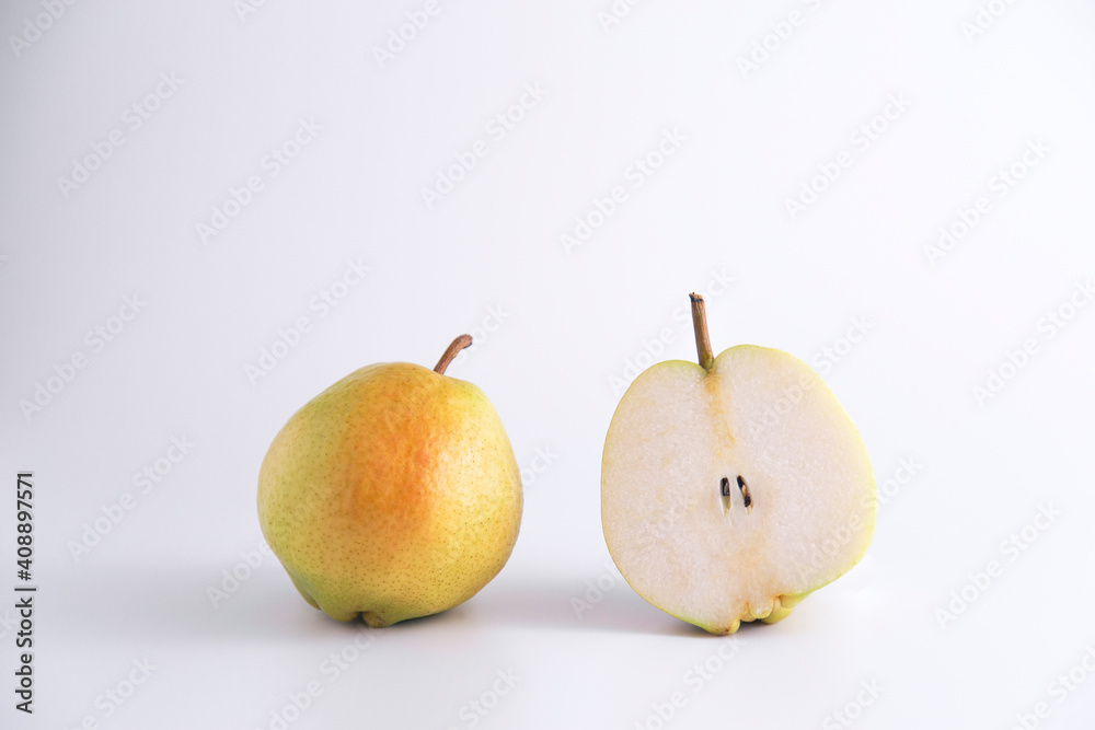 Isolated single and sliced fresh pears over white studio with copy space and vivid image Isolated single and sliced fresh pears over white studio with copy space and vivid image
