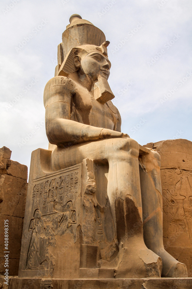 Huge statue of sitting Ramses III pharaoh in Karnak temple