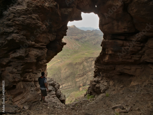 Views from inside a cave towards a deep ravine in gran canaria