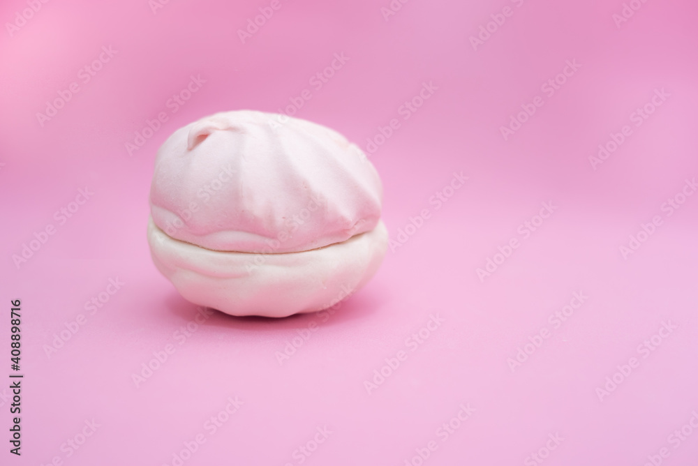 Marshmallow from two halves on a pink background Marshmallow from two halves on a pink background