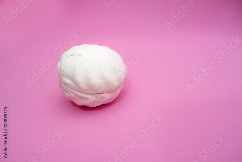Marshmallow from two halves on a pink background