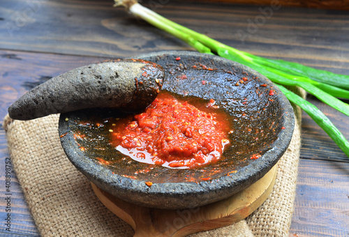 sambal terasi ulek or tomato sauce grind, traditional food from indonesia made from tomato chilli onion and gralic photo