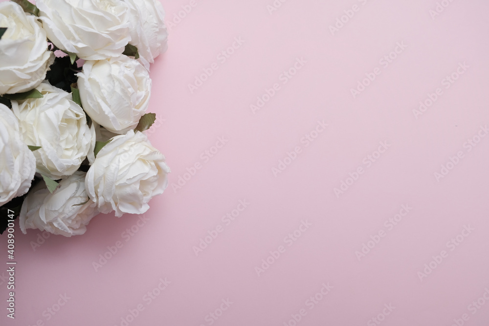 Bouquet of white roses on a pink background isolated. Romantic love background, for Valentine's Day or Women's Day gift concept.