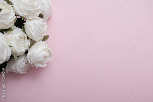 Bouquet of white roses on a pink background isolated. Romantic love background  for Valentine s Day or Women s Day gift concept.