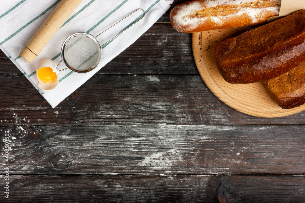 Bakery products. Rye bread and baguette on the table. Baking bread. Flat Lay. Rustic style