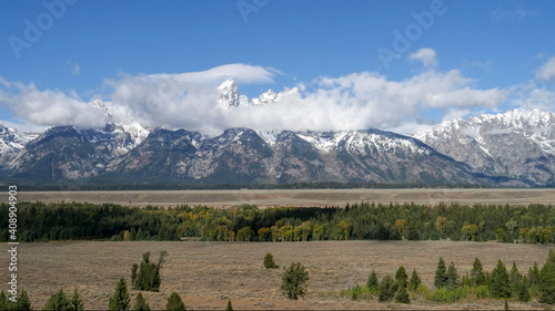 Photography storm clouds clearing from grand teton mountain range