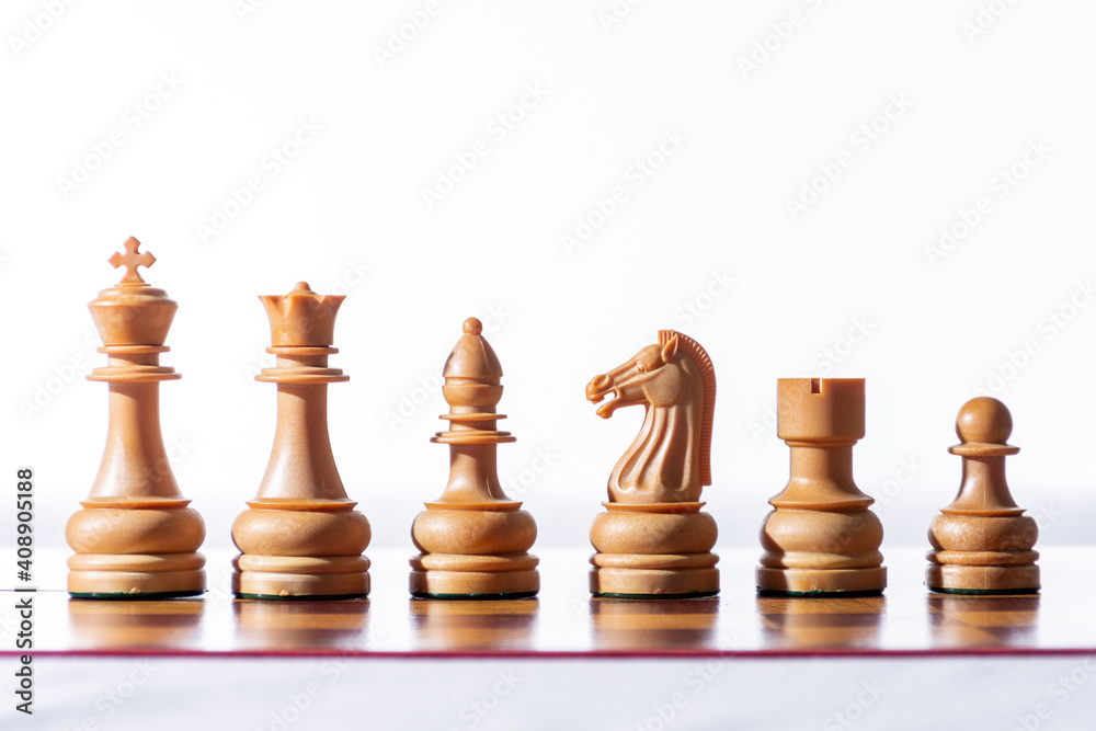 Chess. White chess pieces on chessboard with white background. Chess. White chess pieces on chessboard with white background.