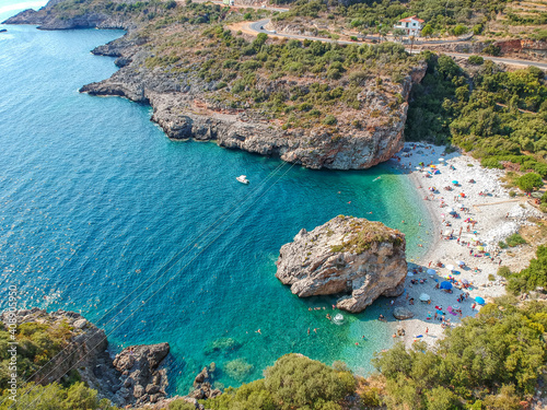 Aerial view of the famous rocky beach Foneas near Kardamyli village in the seaside Messenian Mani area during high tourist Summer period. Messenia, Peloponnese, Greece. photo