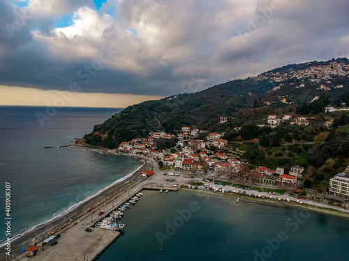 Fototapeta Naklejka Na Ścianę i Meble -  Aerial view of the coastal seaside village Loutraki and the port located in Glossa during winter period. Skopelos island, Sporades, Greece