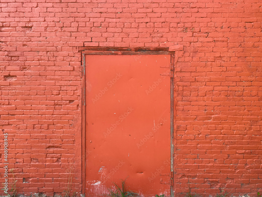 bright red brick barn building wall freshly painted with metal door bright red brick barn building wall freshly painted with metal door