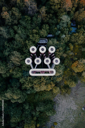 Abandoned power transformer that looks like a sad robot's face from above.