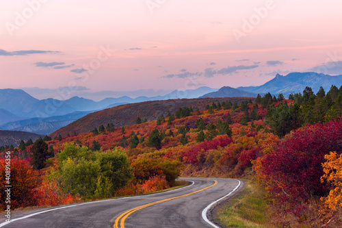 Winding road through autumn colors in the mountains